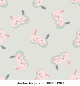 Rabbit light pink color geometric seamless pattern on light green background. Children graphic design element for different purposes. Flat vector illustration.