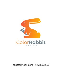 Rabbit logo silhouette and carrot orange color