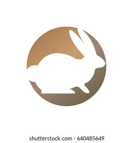Rabbit logo white with round gold and brown circle
