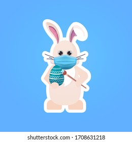 rabbit in mask drawing on egg happy easter bunny sticker spring holiday coronavirus covid-19 pandemic quarantine concept vector illustration