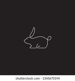 Rabbit one line art logo design. Simple black and white vector illustration. Background black.