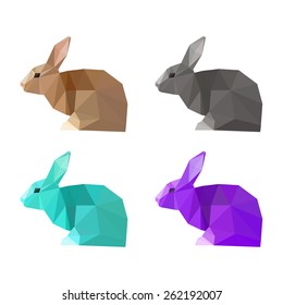 Rabbit painted in imaginary colors. Abstract polygonal rabbit for card, invitation, book, placard. Triangle geometric low poly rabbit set isolated on white. Wildlife, forest animals, nature theme.