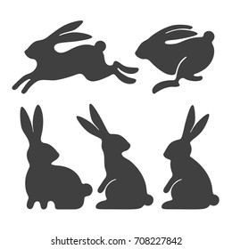 Rabbit set. Stylized silhouettes of sitting and running rabbits, isolated on white background. Vector illustration.