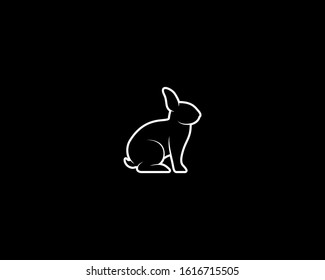 Conejo Silhouette sobre fondo negro. Plantilla de animales vectores aislados para empresa de logotipos, icono, símbolo, etc.
