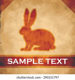 Rabbit silhouette on parchment with dark brown and gold ribbon
