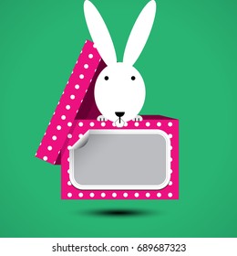 Rabbit sits in box for gift with sticker for your text. Vector illustration