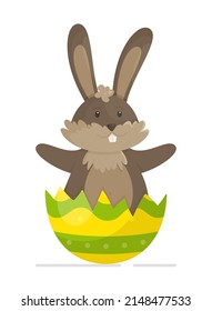 The rabbit sits in the shell of an Easter egg.