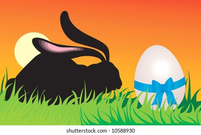  rabbit standing near a gift egg	