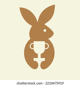Rabbit Trophy Logo Negative Space Concept Vector Template. Rabbit Holding Trophy Symbol