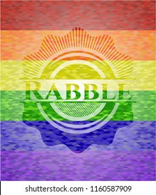 Rabble emblem on mosaic background with the colors of the LGBT flag