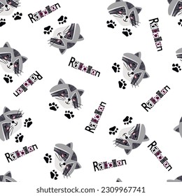 Raccoon seamless pattern with lettering.Cartoon head  of the animal and paws are located randomly on a white background.Cute print on fabric and paper.Endless wallpaper.Vector hand drawn illustration.