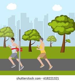 Race in park. The winner crosses finish line