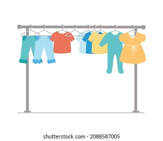 Rack with children 's clothes.  Pants, dresses, T-shirts hang on hangers. Design element