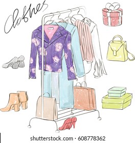 Rack with fashion clothes and shoes