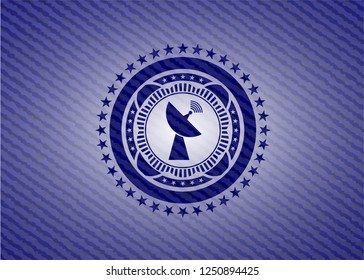radar icon inside badge with denim background
