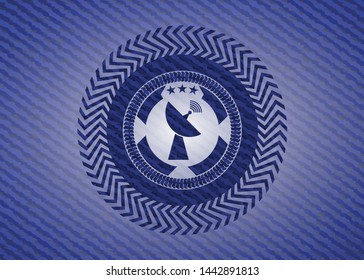 radar icon inside badge with denim texture