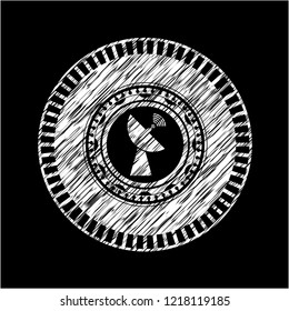 radar icon inside chalk emblem written on a blackboard