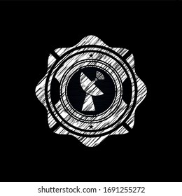 radar icon inside chalk emblem written on a blackboard