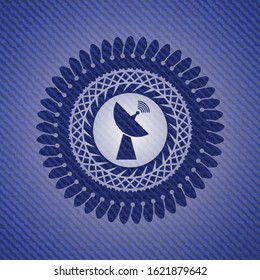 radar icon inside emblem with jean background