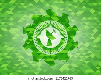 radar icon inside green emblem. Mosaic background