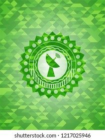 radar icon inside green emblem with mosaic ecological style background