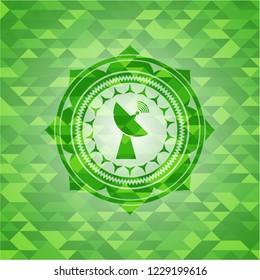 radar icon inside green emblem with mosaic background