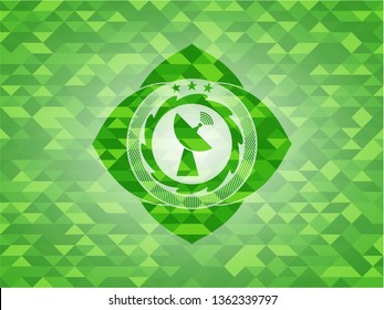 radar icon inside green emblem with triangle mosaic background