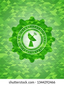 radar icon inside green mosaic emblem