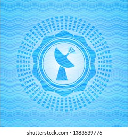 radar icon inside light blue water wave style badge.
