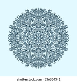 radial pattern of curls and spirals large and complex blue tint