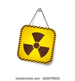 Radiation grunge warning sign hanging on the rope isolated on white