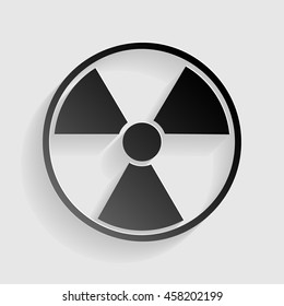 Radiation Round sign. Black paper with shadow on gray background.