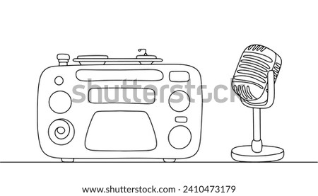 Radio. A device for radio reception and playback of music in everyday life. There is a microphone nearby. World Radio Day. Images produced without the use of any form of AI software at any stage. 