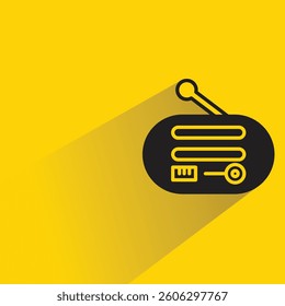 radio with shadow on yellow background