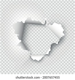 Agujero rasgado en papel rasgado sobre fondo transparente