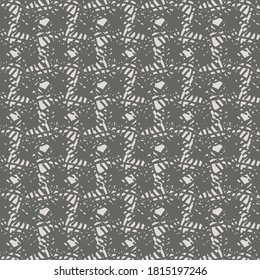Ragged rectangular patches tied together with some rough stitches. Decorative graphics in black and gray. Textile print.