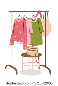 Rail with a summer wardrobe. Bright dresses, a hat and a straw bag. Shopping. Decor in the room. Summer mood. Spring fashion - pastel colored clothes on rail. Sale at clothing store concept.
