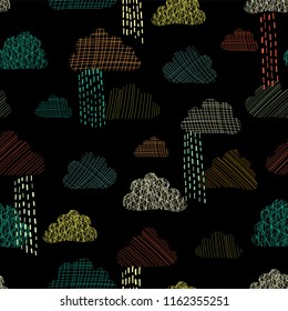 Rain doodle clouds in the sky seamless vector pattern background. Teal, green, orange, and yellow silhouettes of textured clouds on black background. Great for kids, fabric, paper, web banners, cards