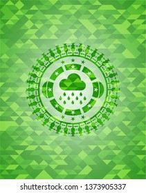 rain icon inside green emblem with triangle mosaic background