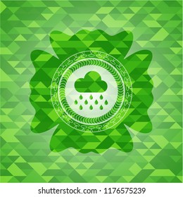 rain icon inside green mosaic emblem