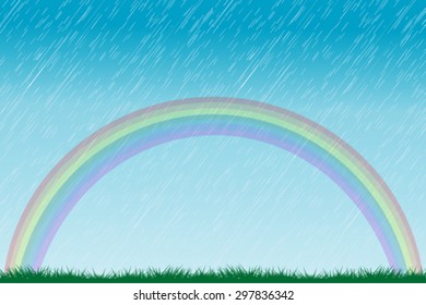 Rain and rainbow over the green field