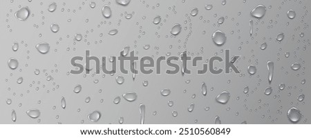 Rain transparent drops flow down the glass.Realistic wet condensation texture.Fresh water splash effect on the surface.Liquid spreading droplet shapes.