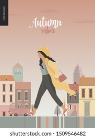 Rain - walking girl wearing raincoat -modern flat vector concept illustration of a young brunette woman in yellow waterproof, walking in the rain in the street, in front of city houses and cars.