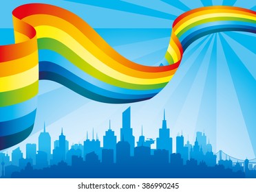 Rainbow in the blue sky and the city on the horizon.