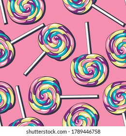 rainbow candy on a stick seamless pattern on pink background