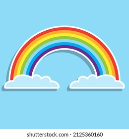 Rainbow with clouds. A cartoon illustration of a rainbow and clouds with a white stroke and shadow on a blue background. Vector, cartoon illustration. Vector.