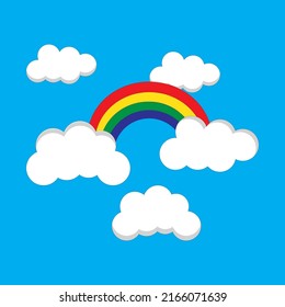 Rainbow With Clouds On Blue Background Free Vector