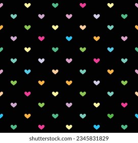 Rainbow color heart seamless pattern on black background Vector