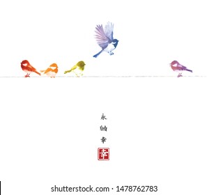 Rainbow colored birds flying in the sky and sitting on a wire. Traditional oriental ink painting sumi-e, u-sin, go-hua. Hieroglyphs - eternity, freedom, happiness.