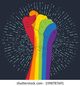 Rainbow colored hand with a fist raised up on the background of retro rays. Gay Pride. LGBT concept. Sticker, patch, t-shirt print, logo design.